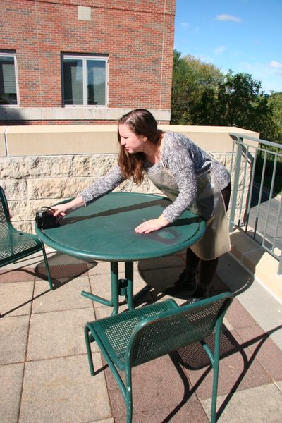 student preparing the hawkeye camera for a selfie tintype