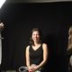 Student laughs getting portrait taken.