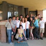 Carleton students along with tour guide on the porch of Robie House.