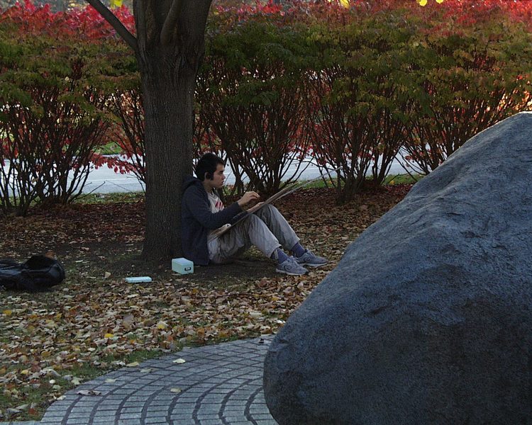 Students enjoy the outdoors as they draw for classes