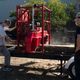 Student guides the log through saw
