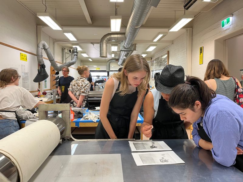 Ruby Mead ‘24, Eunice Gao ‘24, and Miriam Chasnov ‘25 study two stages of a print at the Australian Print Workshop