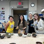 Students picking out bowls