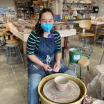 Students design and throw bowls and then hand them off to another person to trim.