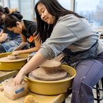 Student prepping bowl for Empty Bowls