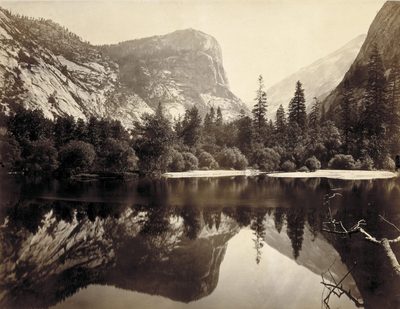 Sepia-toned photo of water, trees, and mountain at Yosemite