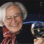 Eleanor Zelliot toasting with a glass of champagne