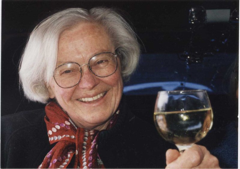 Eleanor Zelliot toasting with a glass of champagne