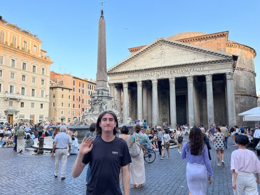 Photo of man standing in a courtyard