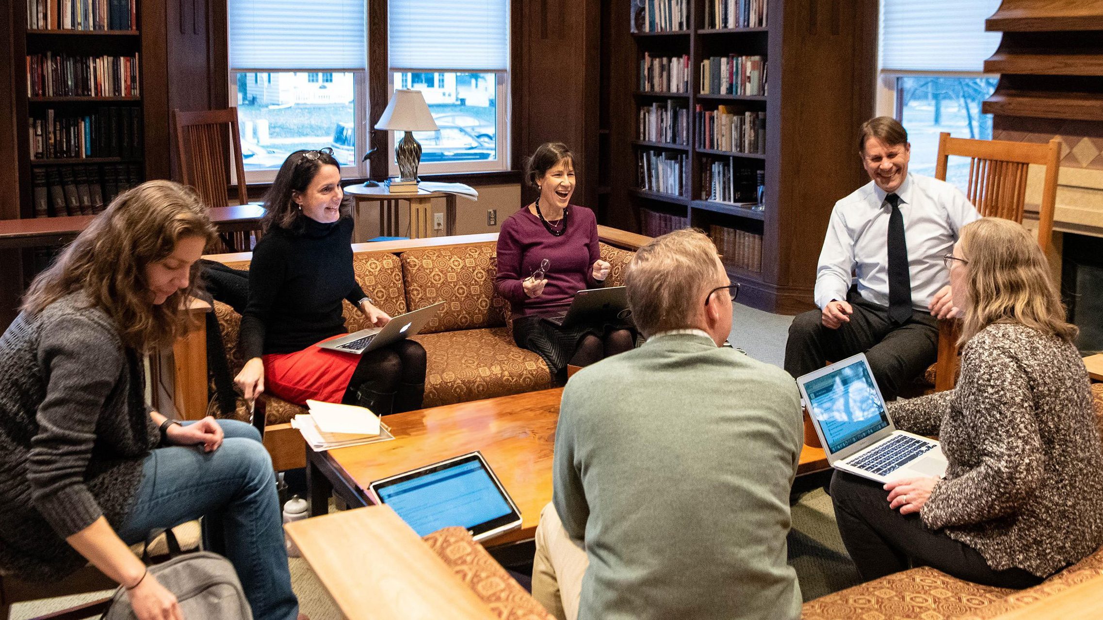 Members of the 2019-20 Humanities Center Faculty Research Seminar meeting in the AGH library