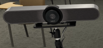 Logitech brand Meetup webcam on tripod.
