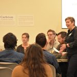 Professor Kelly Connole and three ceramic alums on a panel in front of an audience