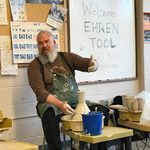 Ceramic Artist Ehren Tool. Ehren Tool sits at a potter's wheel while talking and gesturing with his hands.