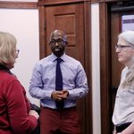 Professor Linda Sturtz, Professor Thabiti Willis, and Academic Technologist Paula Lackie talk during a break