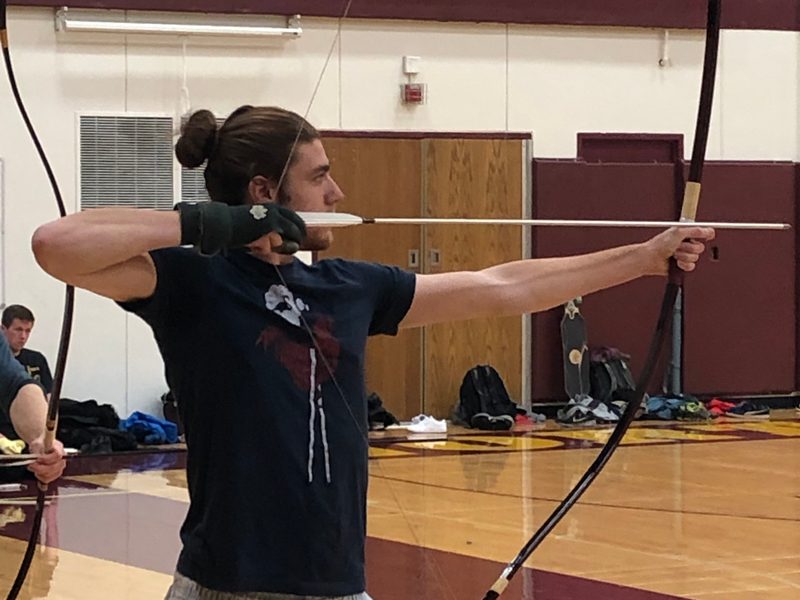 Kyudo Practice. A student draws an arrow.