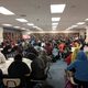 Jimmy Santiago Baca's visit to South High School in Minneapolis. A library is filled with students listening to the poet