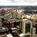 View from the Alumni Downtown Luncheon. View of downtown Minneapolis from a tall building in downtown. Foshay Tower, Mill City Museum, Mississippi River, and Stone Arch Bridge are visible.