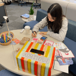 Anika Rajbhandary ('26) decorating New Year's postcards to send to her family and friends.