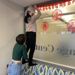 LAs Ping-Xuan Lai (Chinese) and Tifenn Le Minor (French) help decorate the lounge for the New Year!
