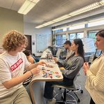 Language Associates sort out bingo sheets to give to eager students