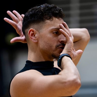 Jason Rodriguez has hands in front of phase in voguing pose