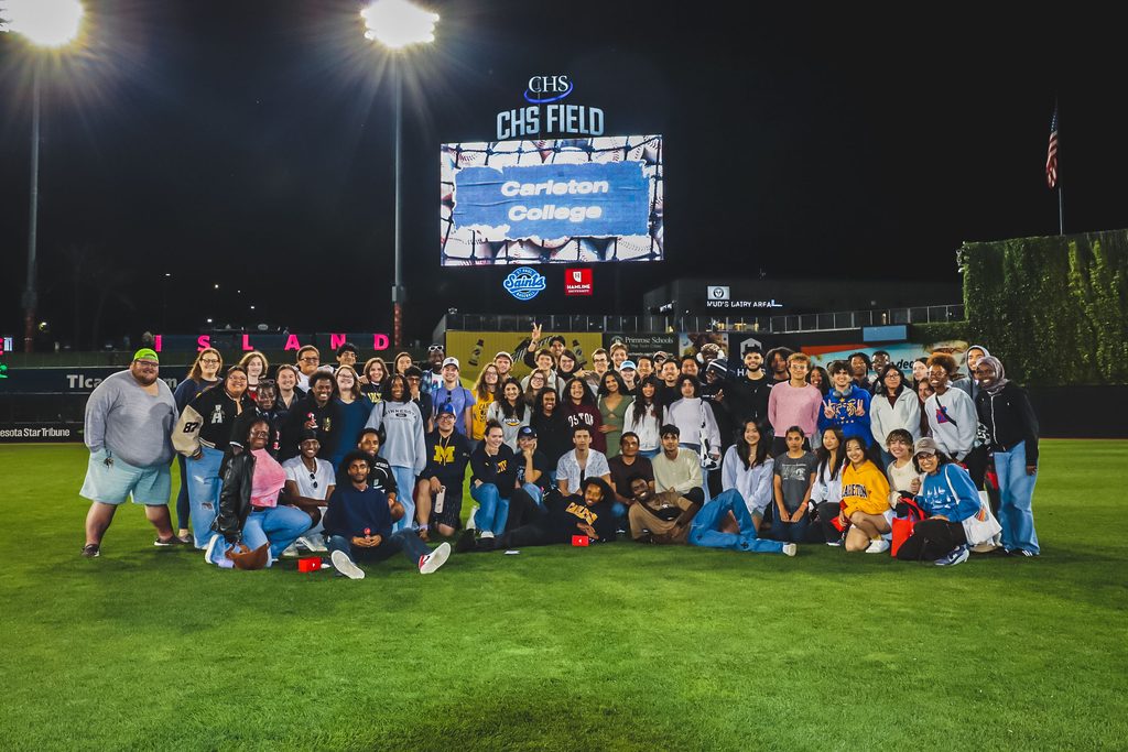 Students in front of a football field