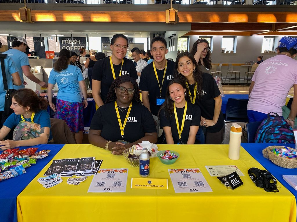 Students sitting at a table at an event