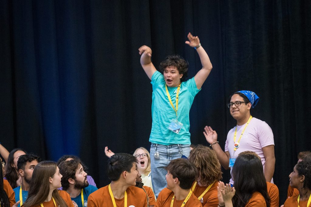 Student excited jumping in a crowd!
