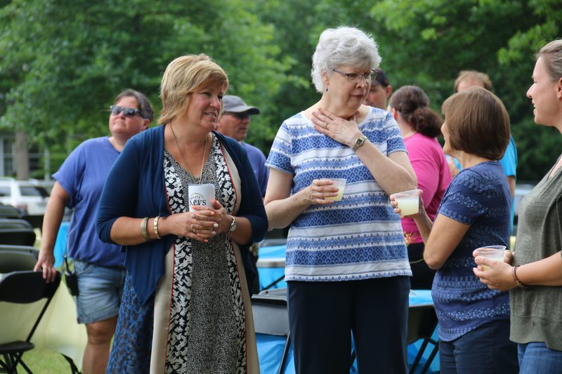 Sara & Tricia talking with Ann & Maria