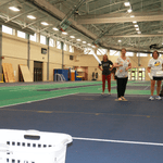 Four people throwing a frisbee