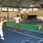 Three people hula hooping