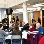 People talking at tables