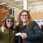 Two staff members posing for a photo