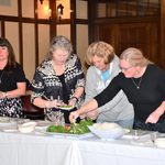 Staff preparing a spring roll.