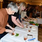 Staff preparing spring rolls