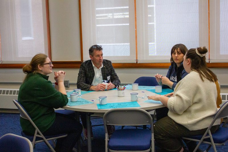People talking at a table.