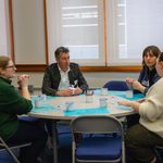People talking at a table.