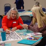 Two people coloring and talking