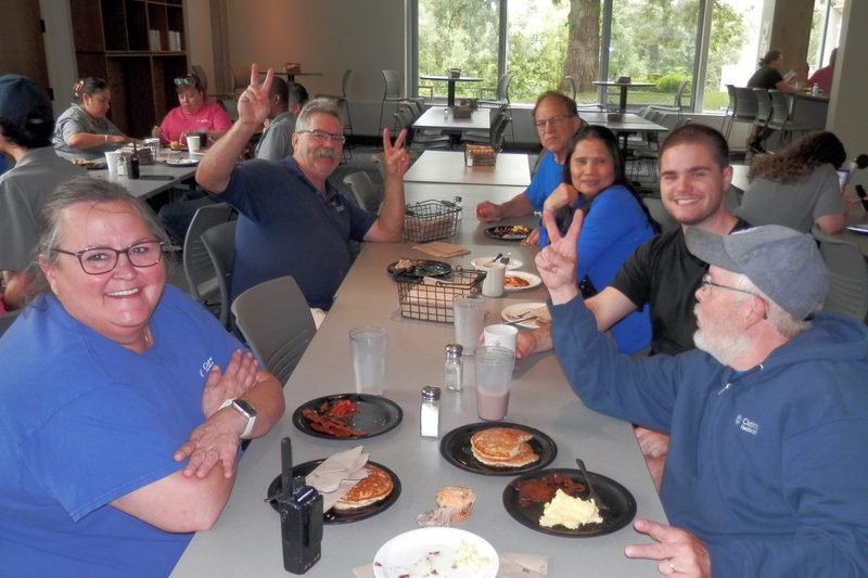 Staff eating breakfast.