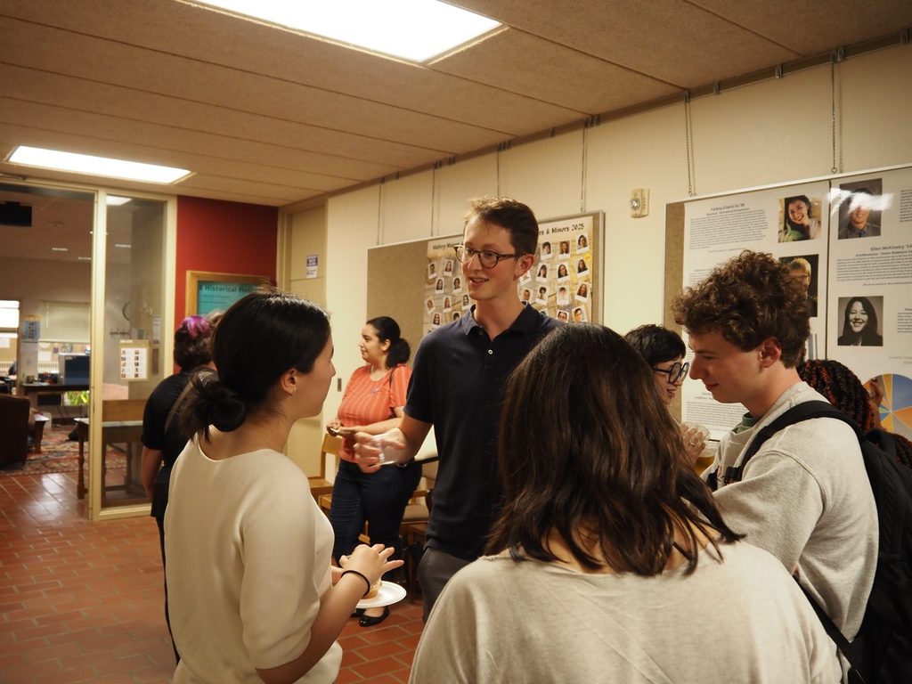 History students sharing summer break stories over apples at AppleFest 24