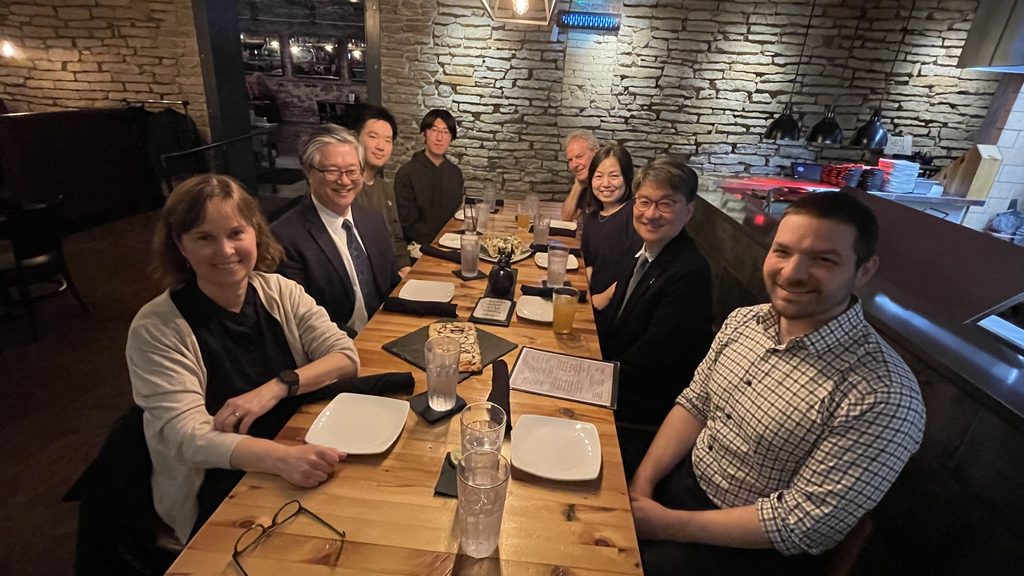Dinner guests around the table starting at the left Prof. Ottaway, Prof. Yoon, Jerry Yang, Losh Li, Bruce Duffy, Prof. Lin Deng, and St. Olaf Professor Eric Becklin.