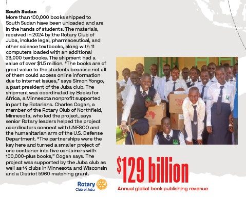 A group of smiling Sudanese students in navy and white school uniforms standing around a pile of boxes labeled Books for Africa. Full image text repeated below.