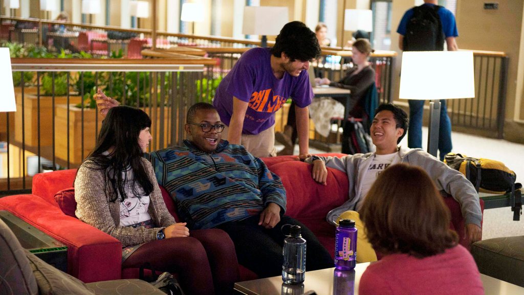 students hang out in the upper level of Sayles-Hill campus center