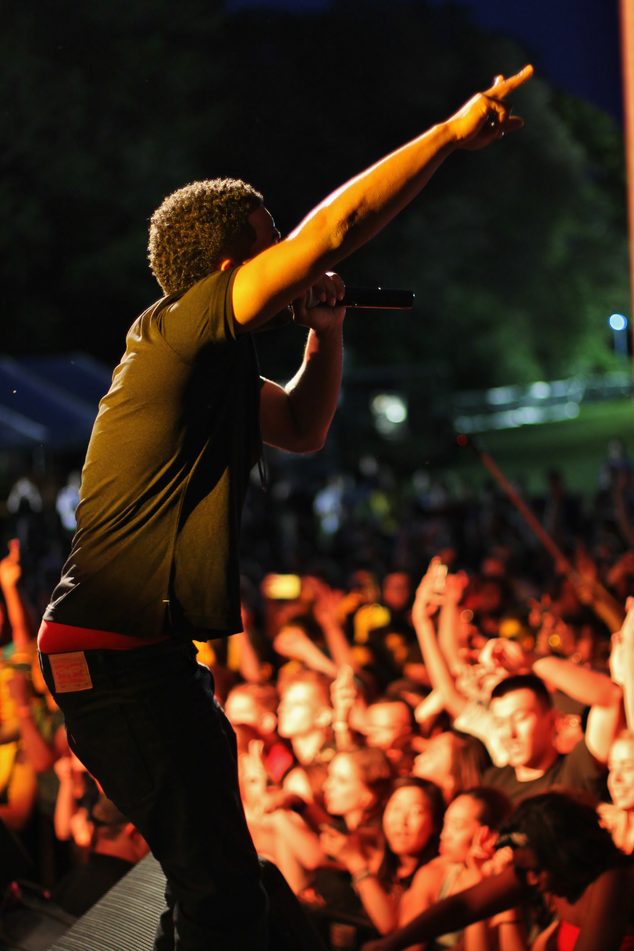 A performer sings to the crowd during the evening portion of Spring Concert