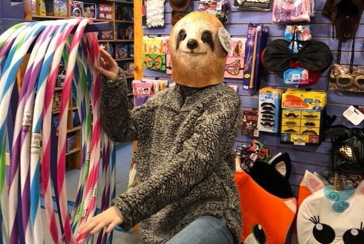 Kamala wearing a sloth mask