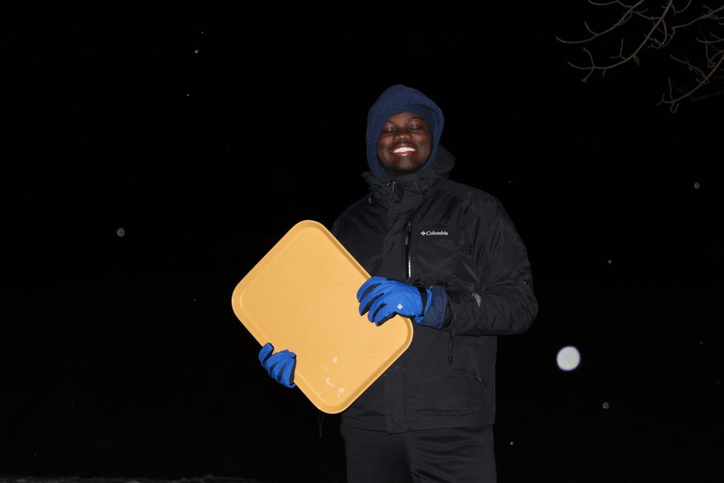 Jevon holding a tray just before traying for the first.