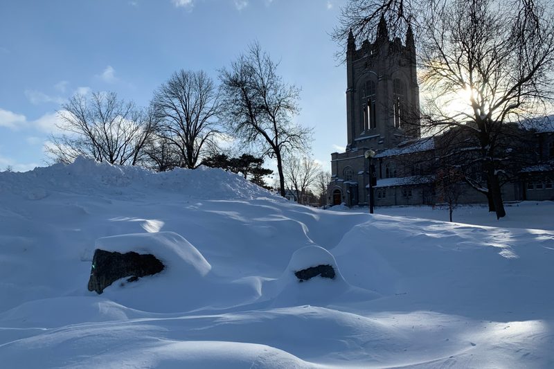 Large pile of snow next to Skinner Memorial Chapel