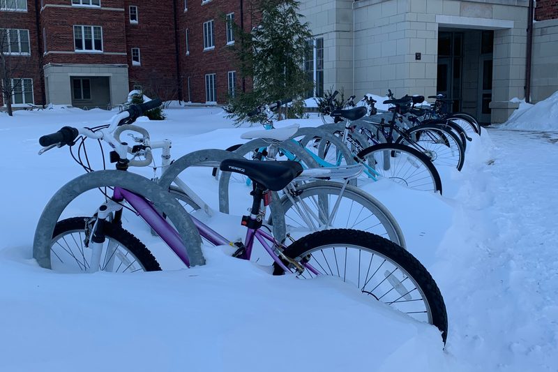 Bikes partially submerged in snow outside of Cassat Hall