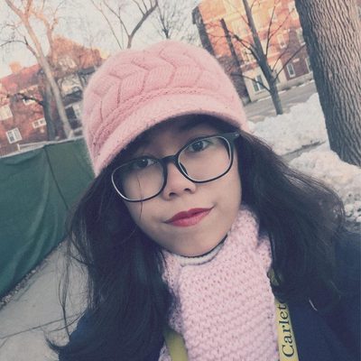 Chi Nguyen wearing a pink hat and scarf
