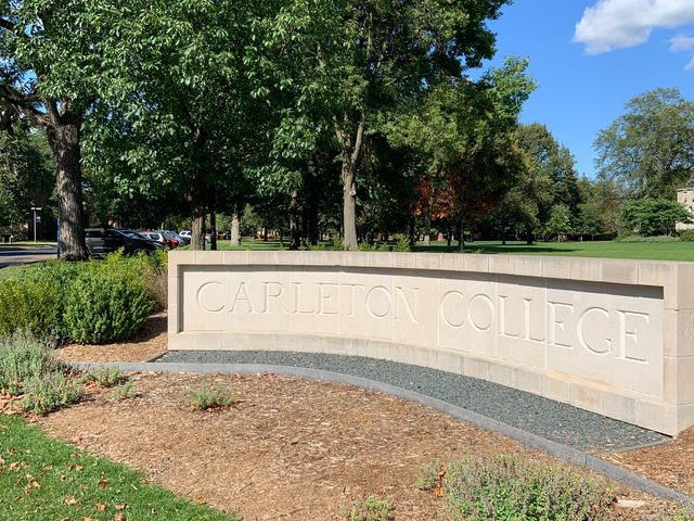 Carleton College sign on a sunny day.